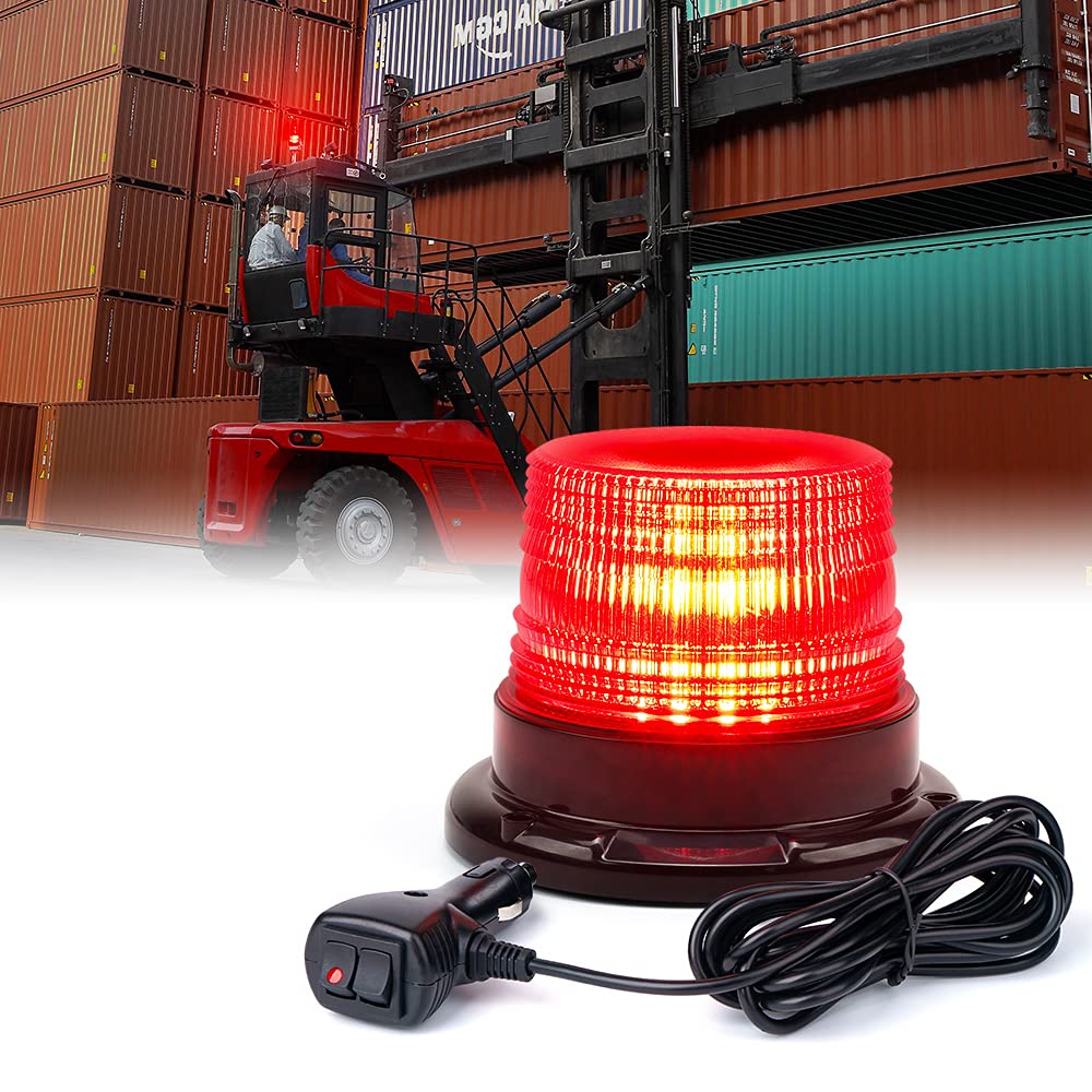 Red warning light with a forklift in a shipping container yard background