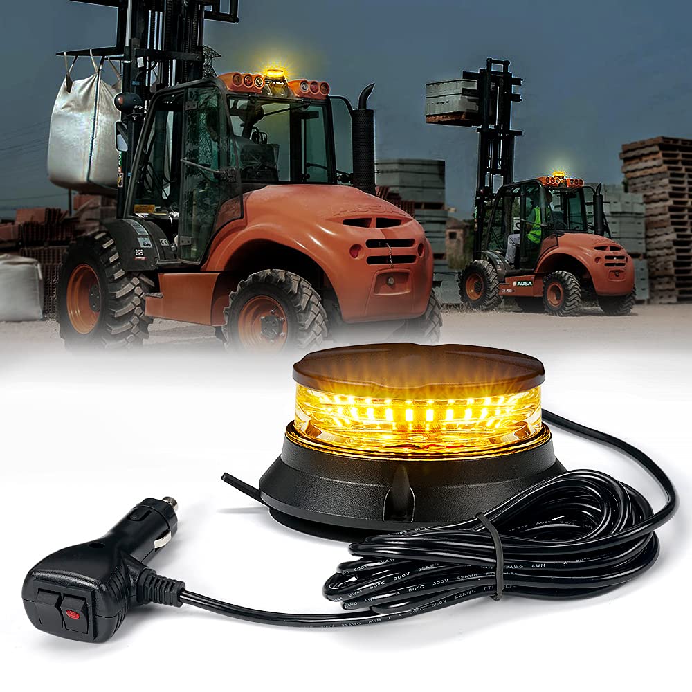 Yellow warning light with power cord in front of a forklift in an industrial setting