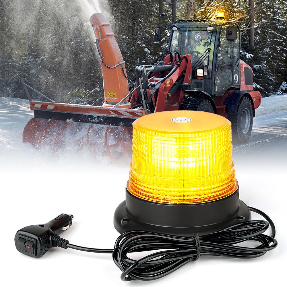 Yellow warning light with cable and car adapter in front of a snowblower clearing snow.