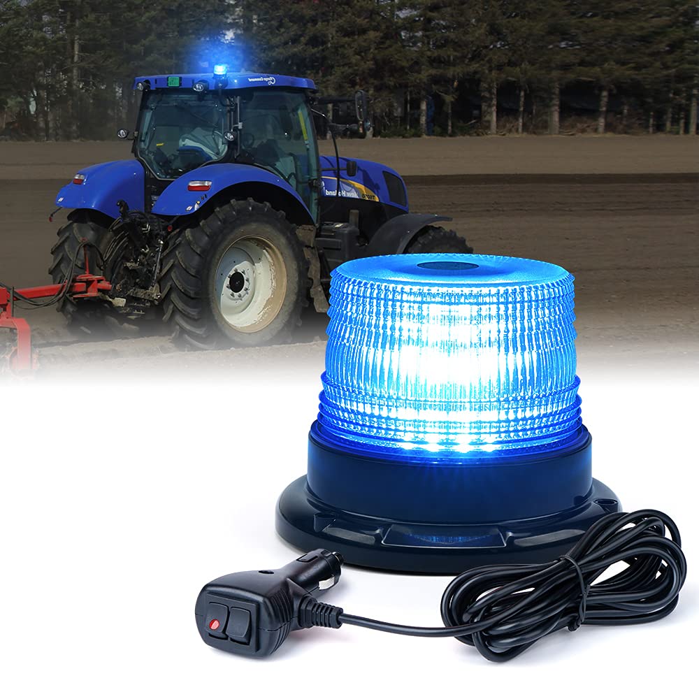 Blue warning light with power cord in front of a tractor on a white background